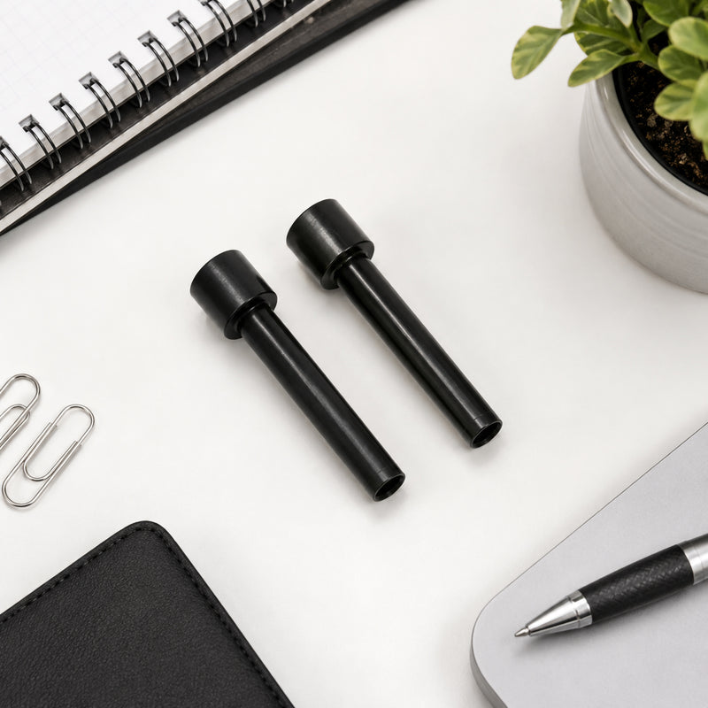 A clean top view of two genuine Rapid HDC300 replacement punching cutters positioned neatly on a modern office desk alongside stationery, paper clips, a notebook and laptop. The composition highlights the replacement parts while reinforcing their professional office application.