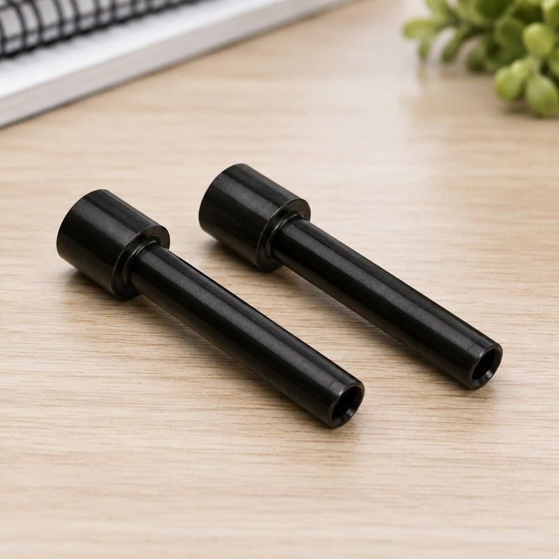 A close up lifestyle image featuring the pair of Rapid HDC300 replacement punching cutters resting on a wooden desktop with office stationery and notebooks softly blurred in the background. The image emphasises the precision machined design and genuine replacement quality.