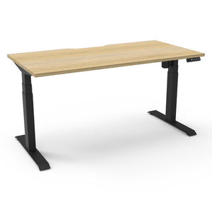 Rapidline Boost Light single sided electric sit-stand desk with a natural oak top on a black frame, with the controller at the front right edge