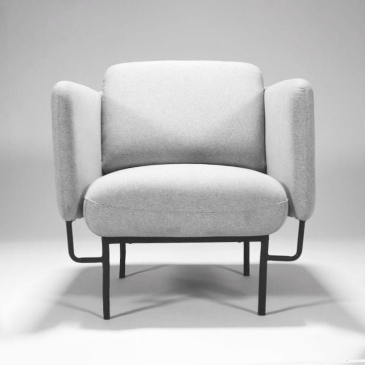 Rapidline Capri one seater lounge in light grey fabric photographed straight on from the front on its black steel base.