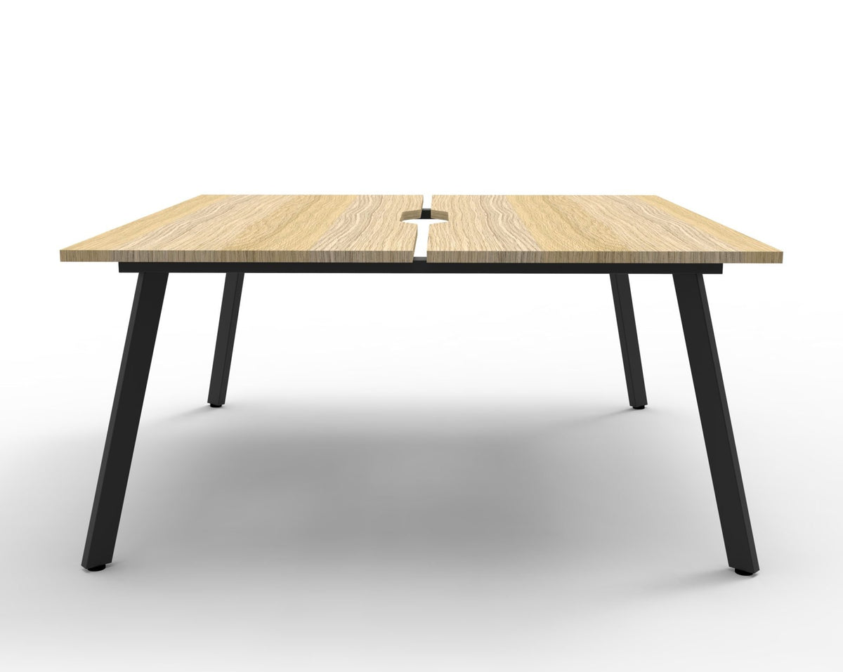 Front view of the Rapidline Eternity back to back 2 person workstation in Natural Oak and Black Satin, no screen, showing the centre gap between the tops