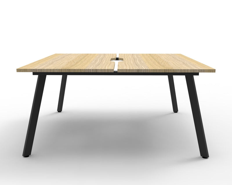 Front view of the Rapidline Eternity back to back 2 person workstation in Natural Oak and Black Satin, no screen, showing the centre gap between the tops