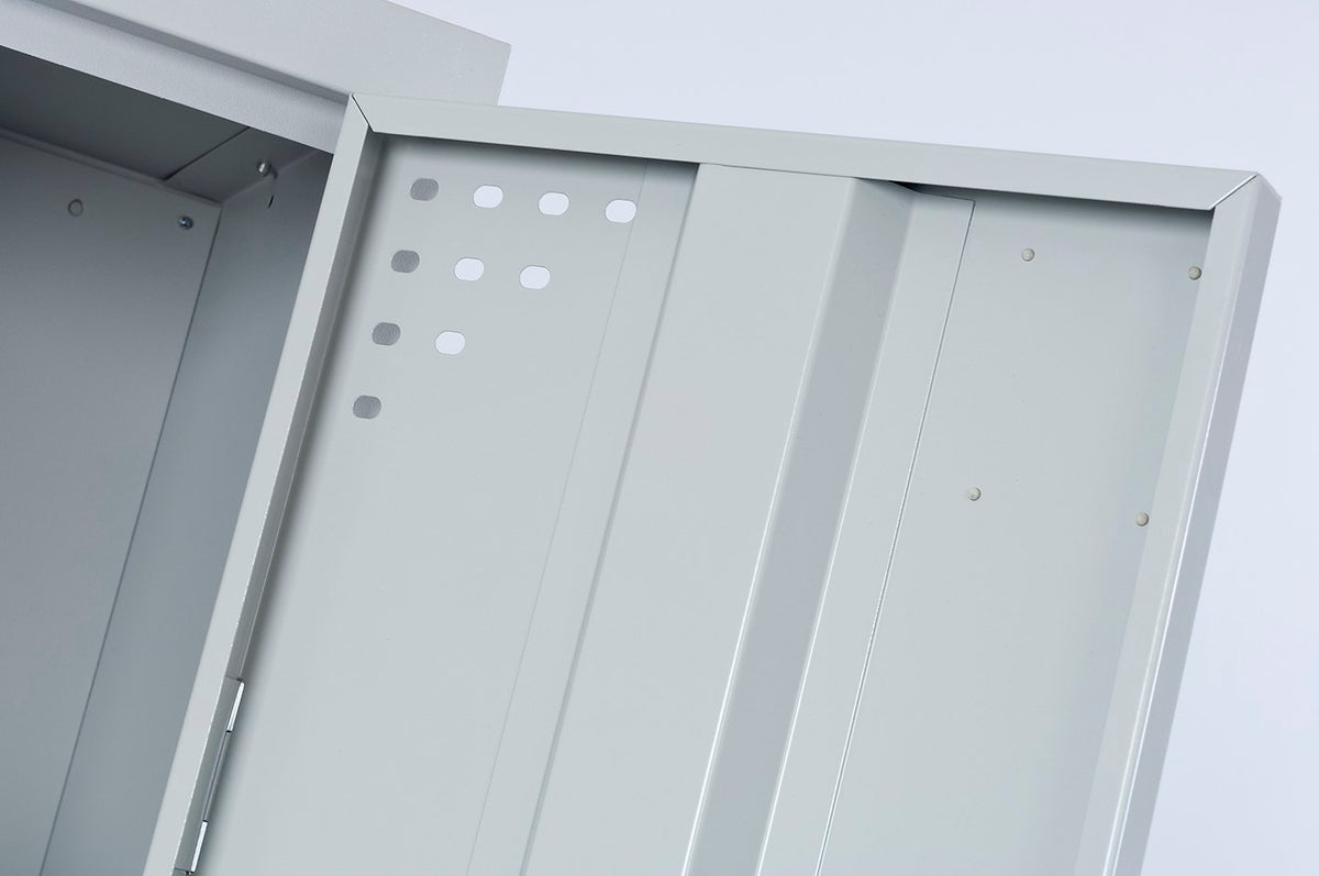 Silver grey Rapidline Go steel locker with a door swung open, showing the inside face of the door, the stiffener and the vent holes