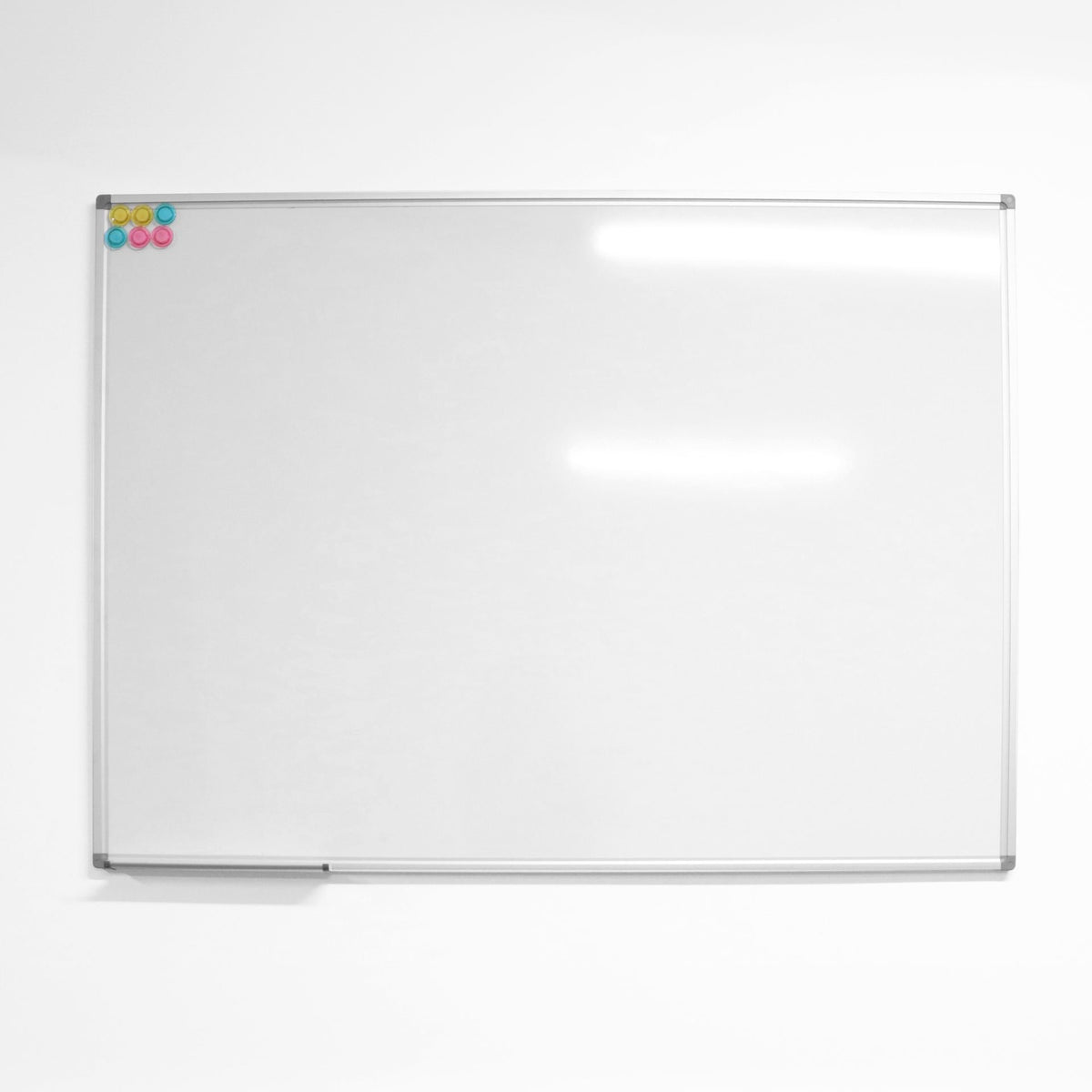 Rapidline Standard Whiteboard range, front view of the white writing surface with a silver aluminium frame, grey corner caps and a pen tray along the bottom edge.