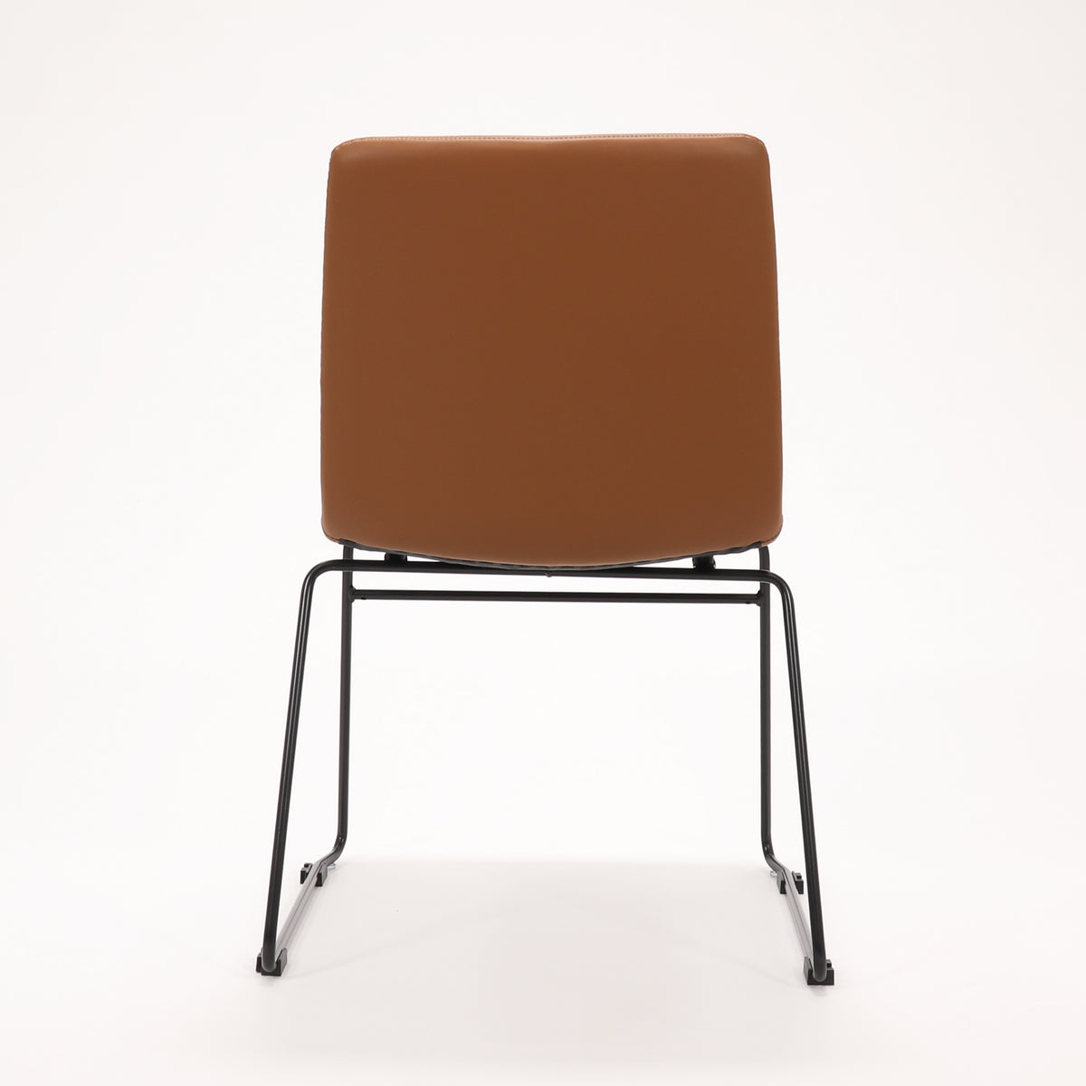 Rapidline Pixel sled base visitor chair in amber PU on a black powdercoated continuous sled base, product photograph on a plain background showing the ribbed horizontal stitching across the seat and back.