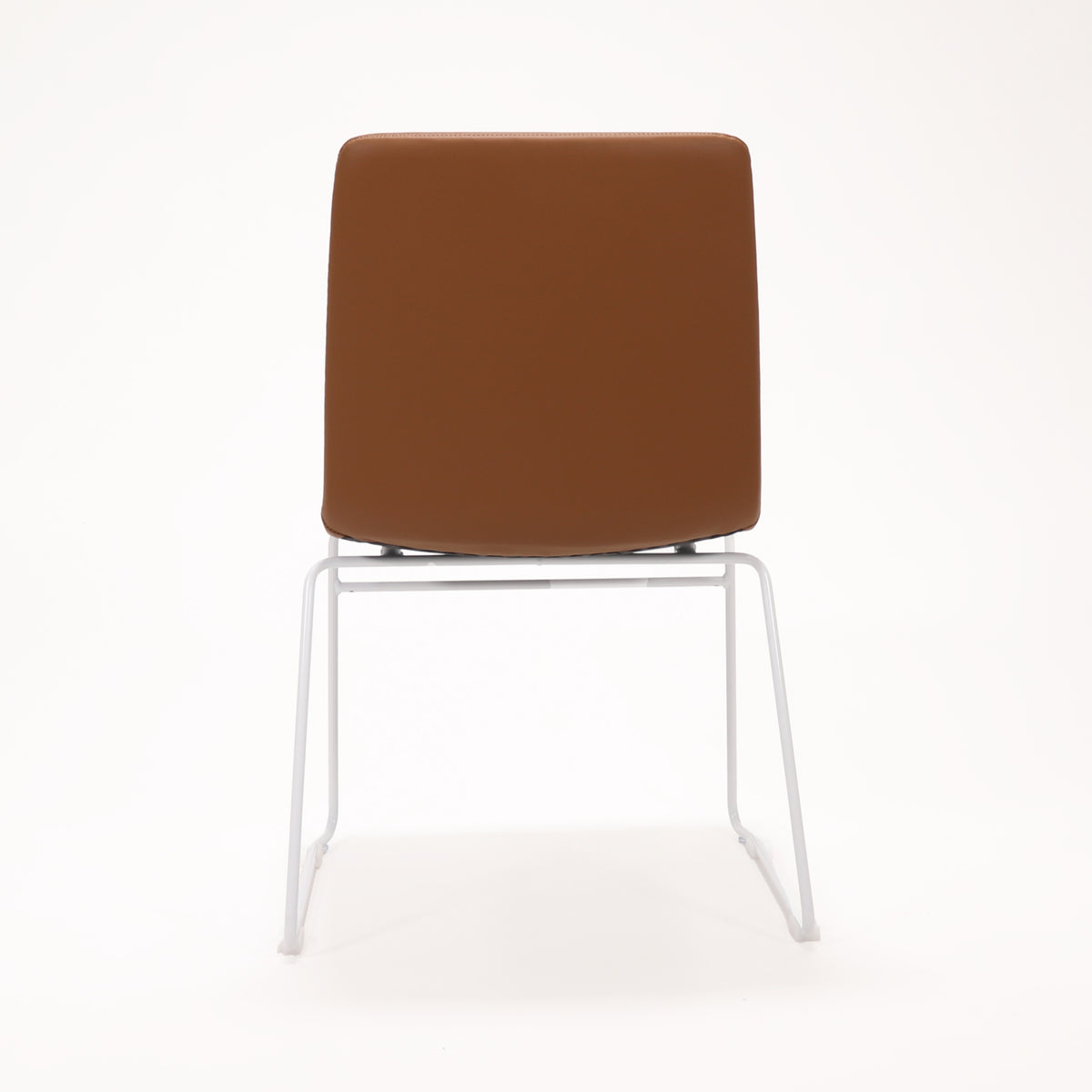 Rapidline Pixel sled base visitor chair in amber PU on a white powdercoated continuous sled base, product photograph on a plain background showing the ribbed horizontal stitching across the seat and back.