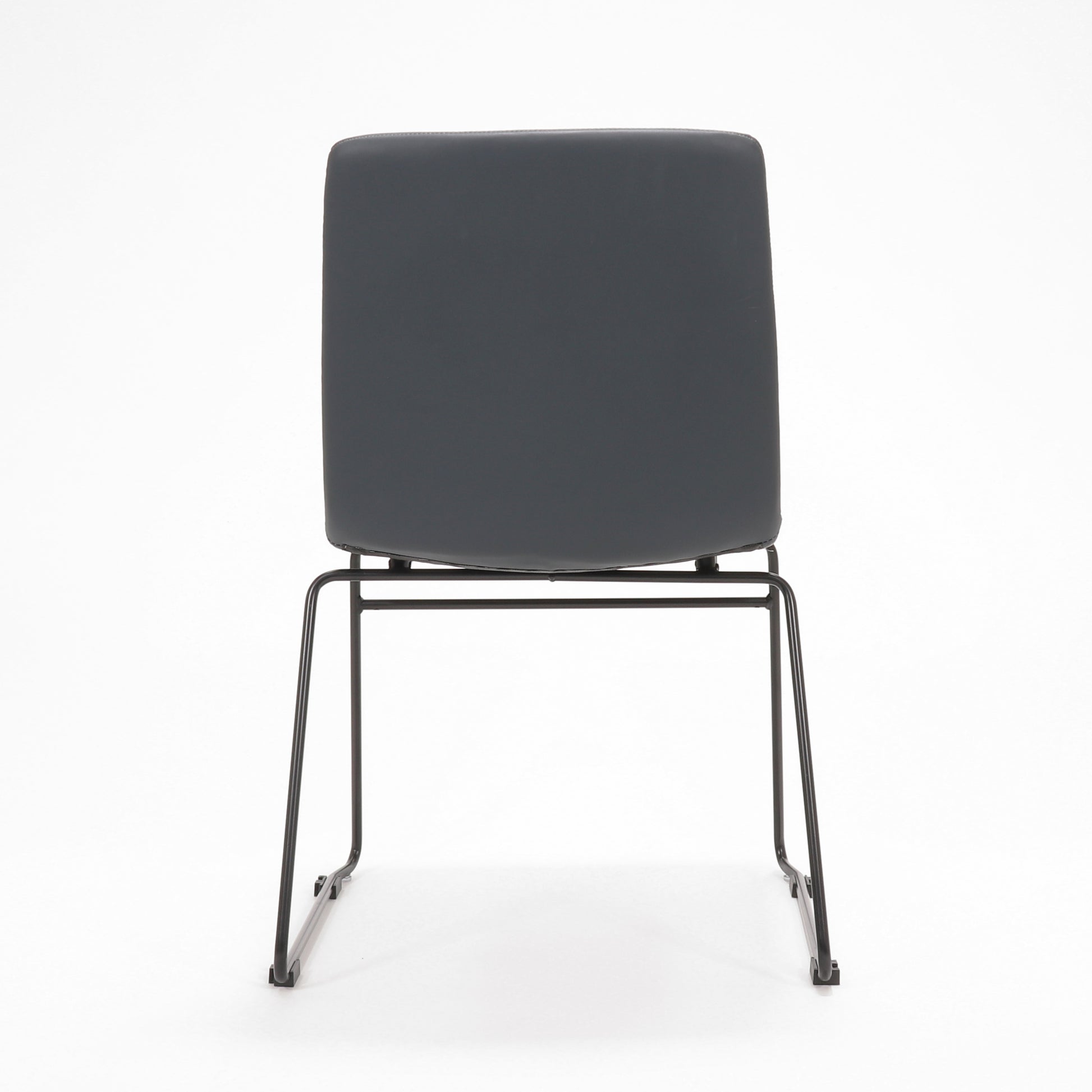 Rapidline Pixel sled base visitor chair in French Navy PU on a black powdercoated continuous sled base, product photograph on a plain background showing the ribbed horizontal stitching across the seat and back.