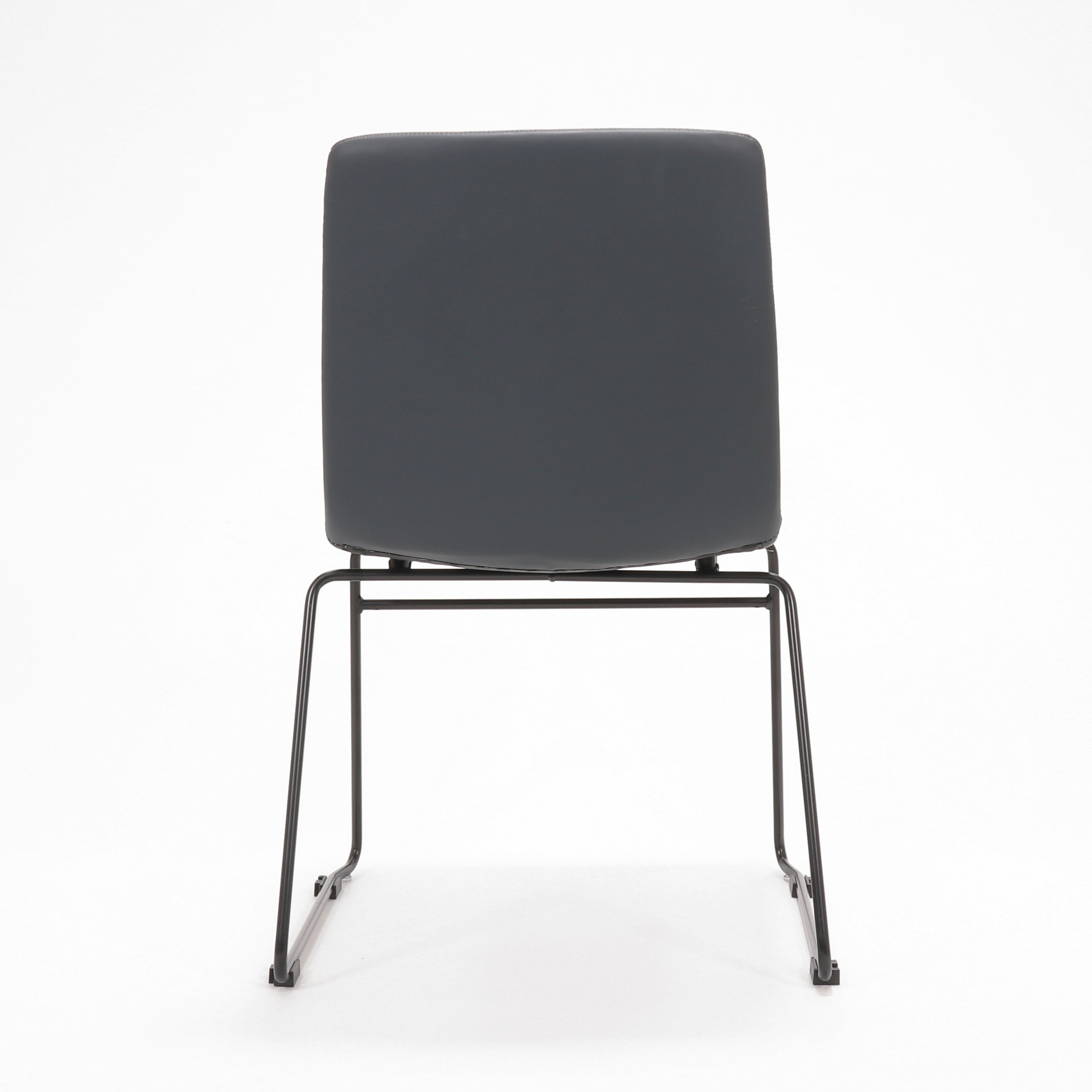 Rapidline Pixel sled base visitor chair in French Navy PU on a black powdercoated continuous sled base, product photograph on a plain background showing the ribbed horizontal stitching across the seat and back.