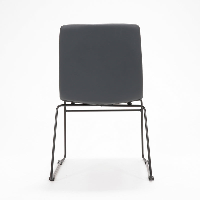 Rapidline Pixel sled base visitor chair in French Navy PU on a black powdercoated continuous sled base, product photograph on a plain background showing the ribbed horizontal stitching across the seat and back.