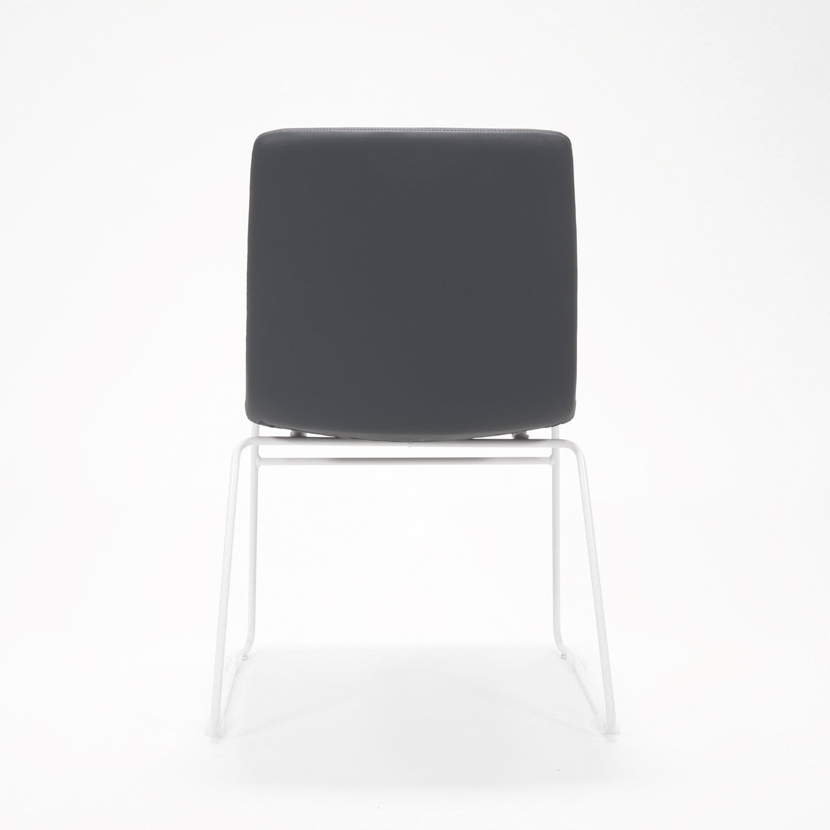Rapidline Pixel sled base visitor chair in French Navy PU on a white powdercoated continuous sled base, product photograph on a plain background showing the ribbed horizontal stitching across the seat and back.