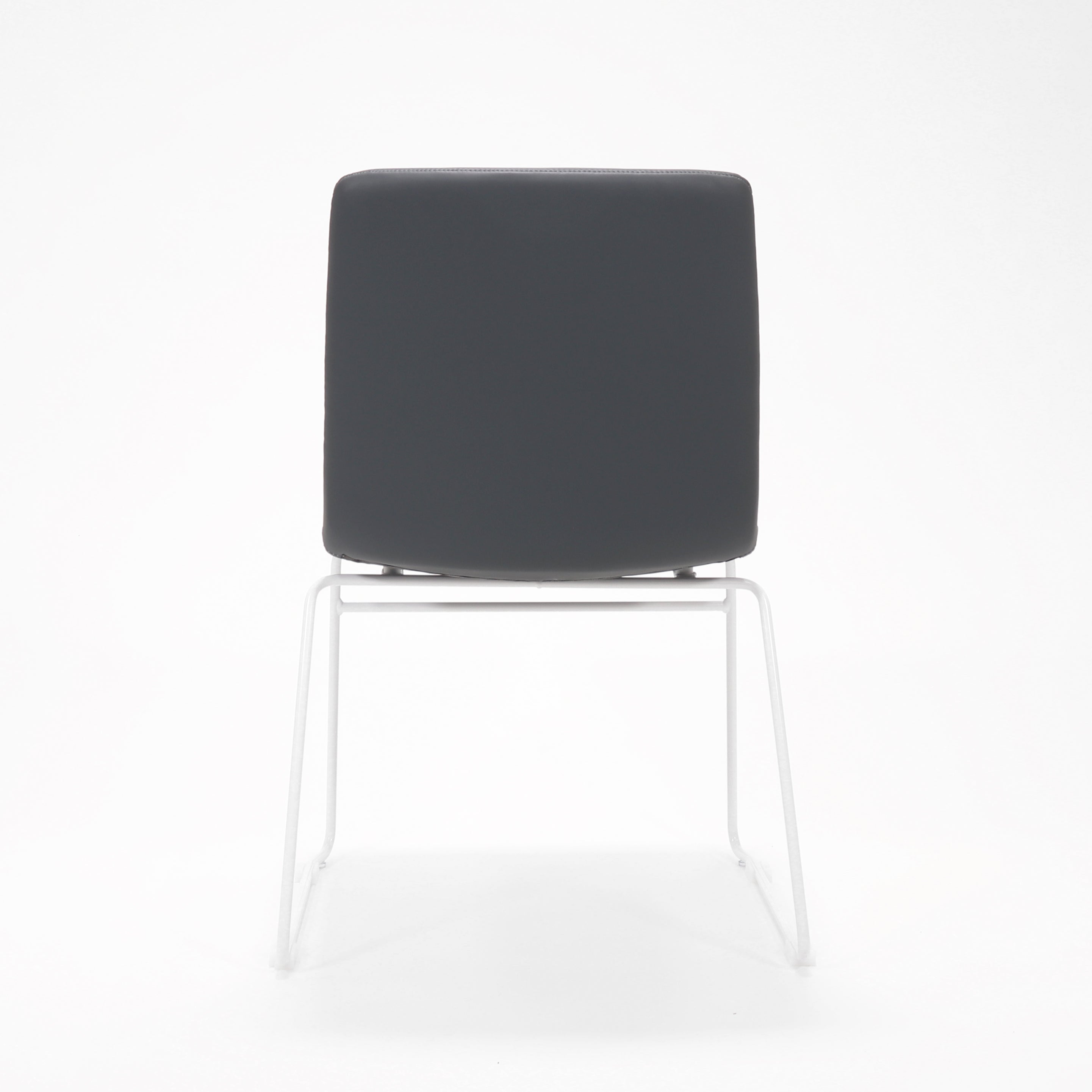 Rapidline Pixel sled base visitor chair in French Navy PU on a white powdercoated continuous sled base, product photograph on a plain background showing the ribbed horizontal stitching across the seat and back.