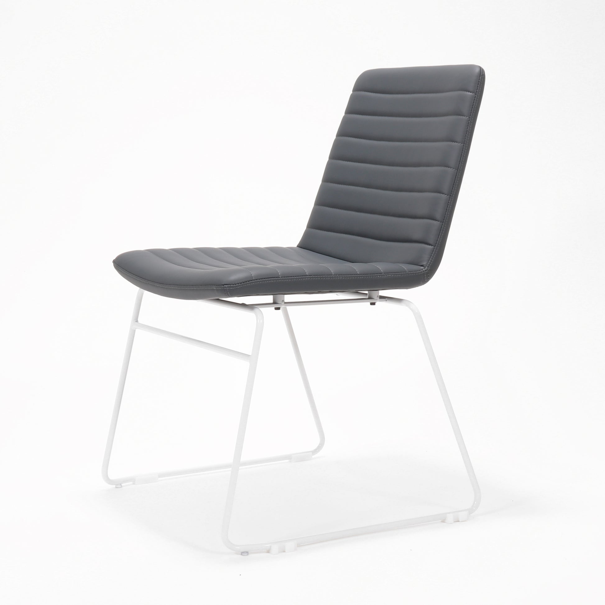 Rapidline Pixel sled base visitor chair in French Navy PU on a white powdercoated continuous sled base, product photograph on a plain background showing the ribbed horizontal stitching across the seat and back.