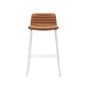 Rapidline Pixel bar high stool in amber PU on a white powdercoated tall sled base with a foot rail, product photograph on a plain background showing the ribbed horizontal stitching across the seat and back.