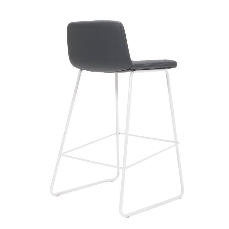 Rapidline Pixel bar high stool in French Navy PU on a white powdercoated tall sled base with a foot rail, product photograph on a plain background showing the ribbed horizontal stitching across the seat and back.