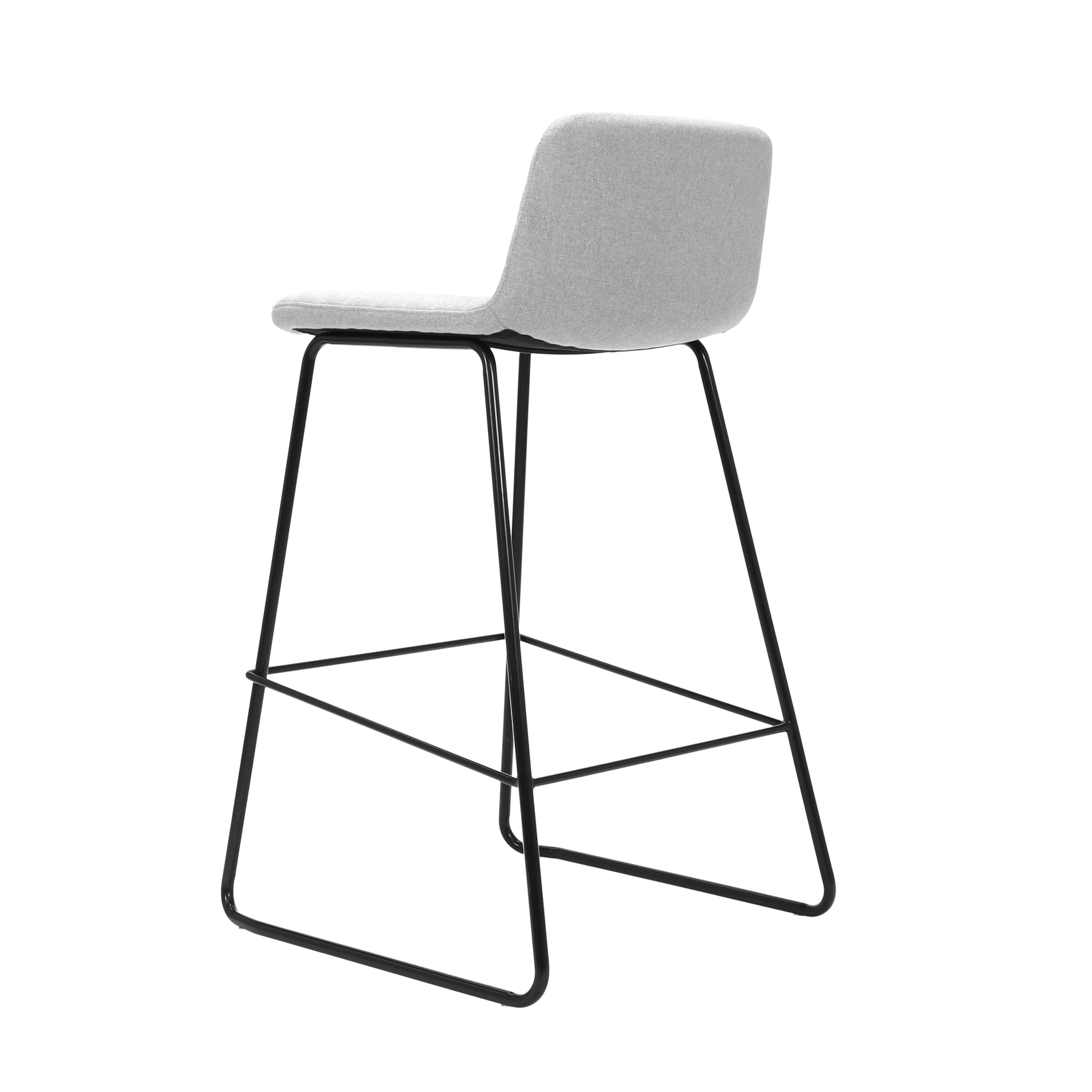 Rapidline Pixel bar high stool in light grey commercial fabric on a black powdercoated tall sled base with a foot rail, product photograph on a plain background showing the ribbed horizontal stitching across the seat and back.