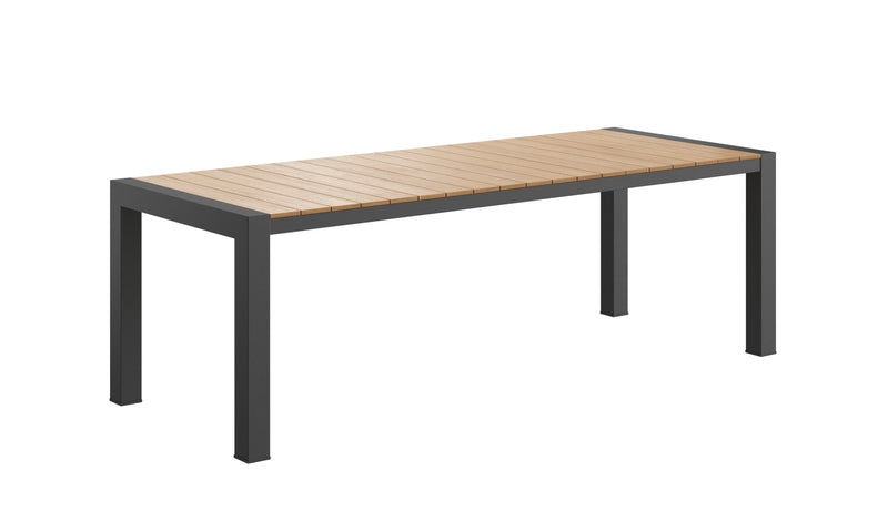 Rapidline Ridge rectangular outdoor table in a paved courtyard setting, showing the long slatted top and black frame at standard dining height.