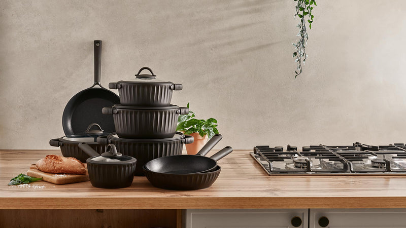 The Resto Ascella cookware range set out together on a kitchen counter (Resto series banner image)
