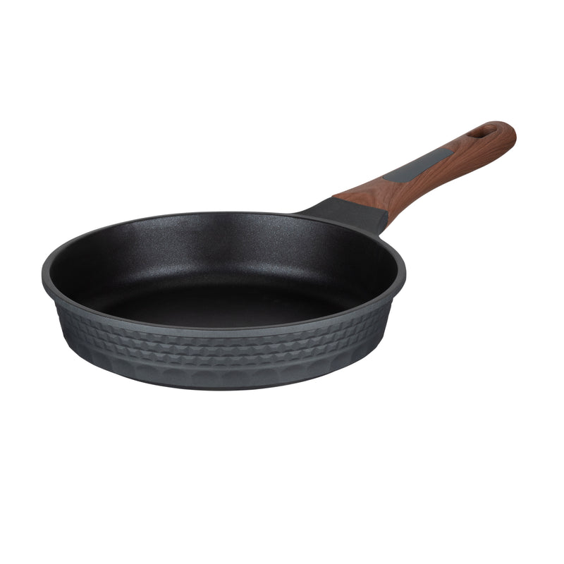Resto Capella 24cm frypan from a three-quarter angle, showing the grey 3D-textured exterior, black non-stick interior and wood-grain handle