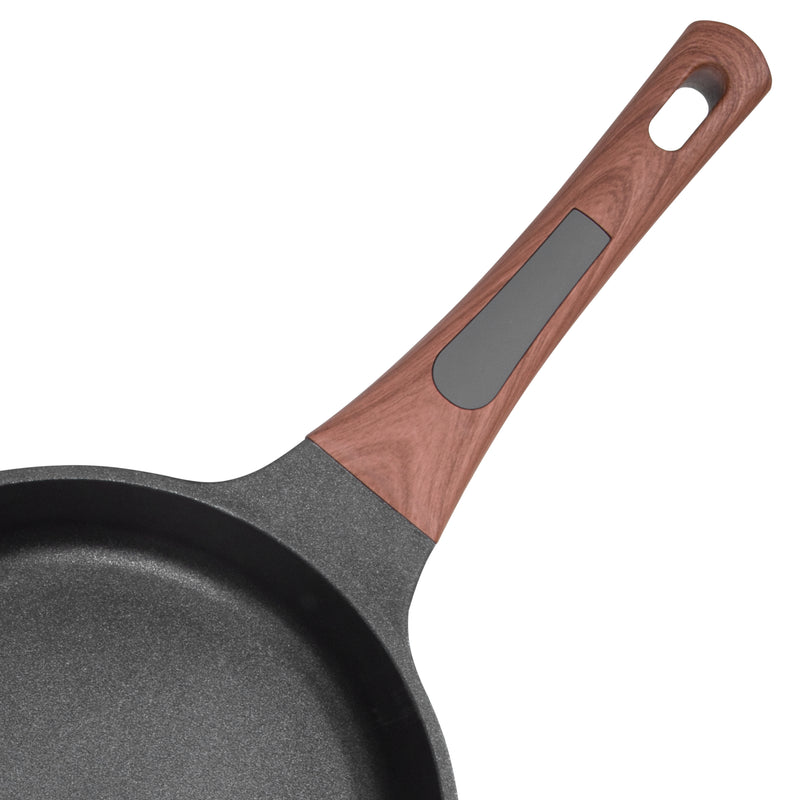 Close-up of the Resto Capella 24cm frypan interior and the wood-grain soft-touch handle with its hanging loop