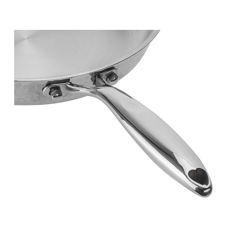 Close-up of the riveted stainless steel handle where it joins the hammered wall of the Resto Crater frypan