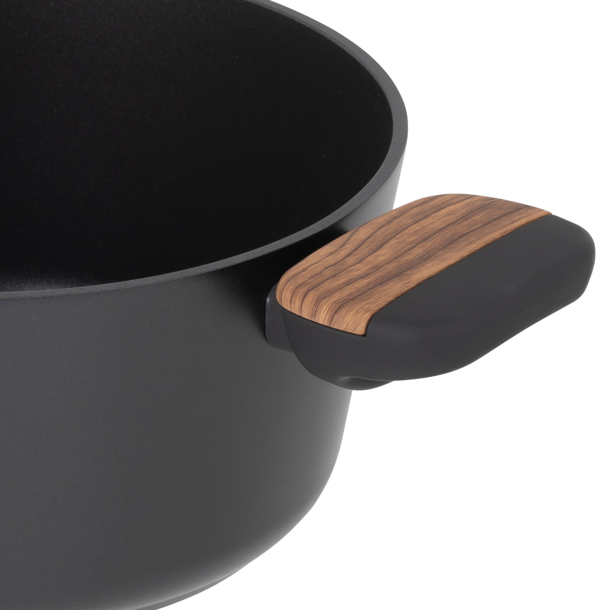 Close-up of a Resto Mon casserole soft-touch side handle with its wood-like insert