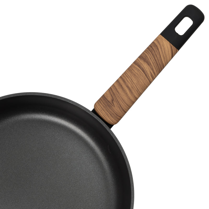 Close-up of the Resto Mon soft-touch handle with its wood-like insert and hanging loop