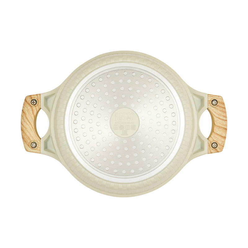 Underside of the beige Resto Ran 20cm casserole showing the induction base plate