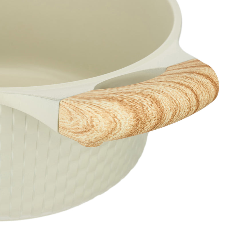 Close-up of one of the two wood-grain-effect soft-touch side handles on the beige Resto Ran casserole