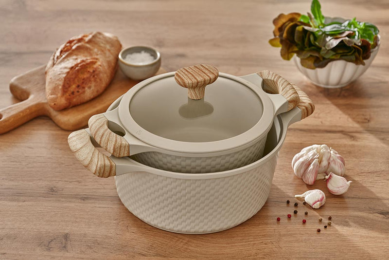 Beige Resto Ran casseroles in 20cm and 24cm stacked together in a styled kitchen scene