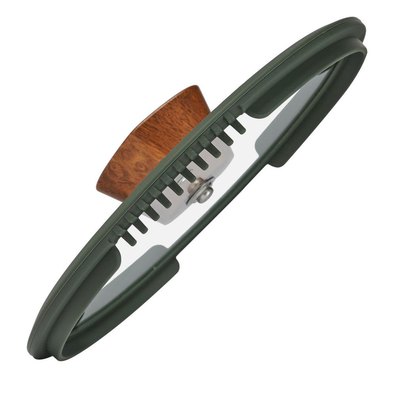 The tempered glass lid of the Resto Sadr 20cm casserole, angled to show the straining holes, silicone rim and wood-like knob