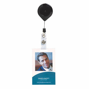 Black Rexel retractable card reel with a thin cord and a clear strap with a press stud, holding a portrait sample ID card with a photo