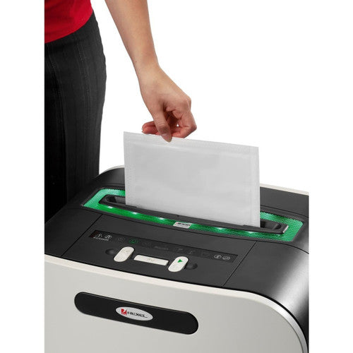 Rexel Shredder Oil Sheet being fed into a desktop office shredder