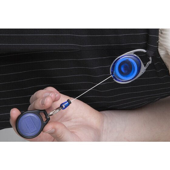 Rexel blue snap lock key holder clipped to a dark pinstriped jacket, the cord pulled out to a hand holding a blue oval access fob.