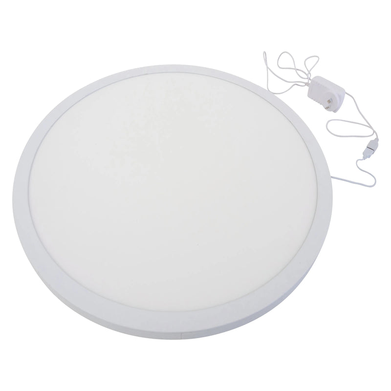 Clean product view of the MTA Essentials 60cm Round Colour Changing Light Panel against a white background. The large circular illuminated surface, slim surrounding frame, power lead and adaptor are clearly visible for easy assessment of the classroom light panel design.