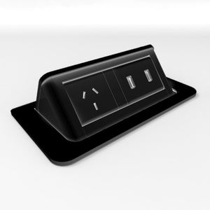 Rapidline pop-up in desk power module in black, raised open to show 1 GPO and 2 USB-A ports above the flush desk plate