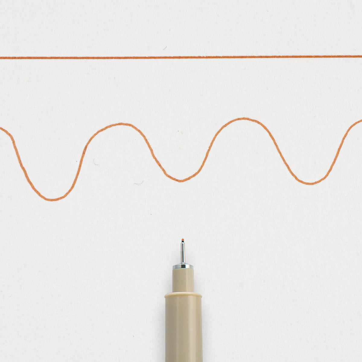 Sakura Pigma Micron 01 Brown: needle tip below a straight and a wavy 0.25mm test line drawn on white paper
