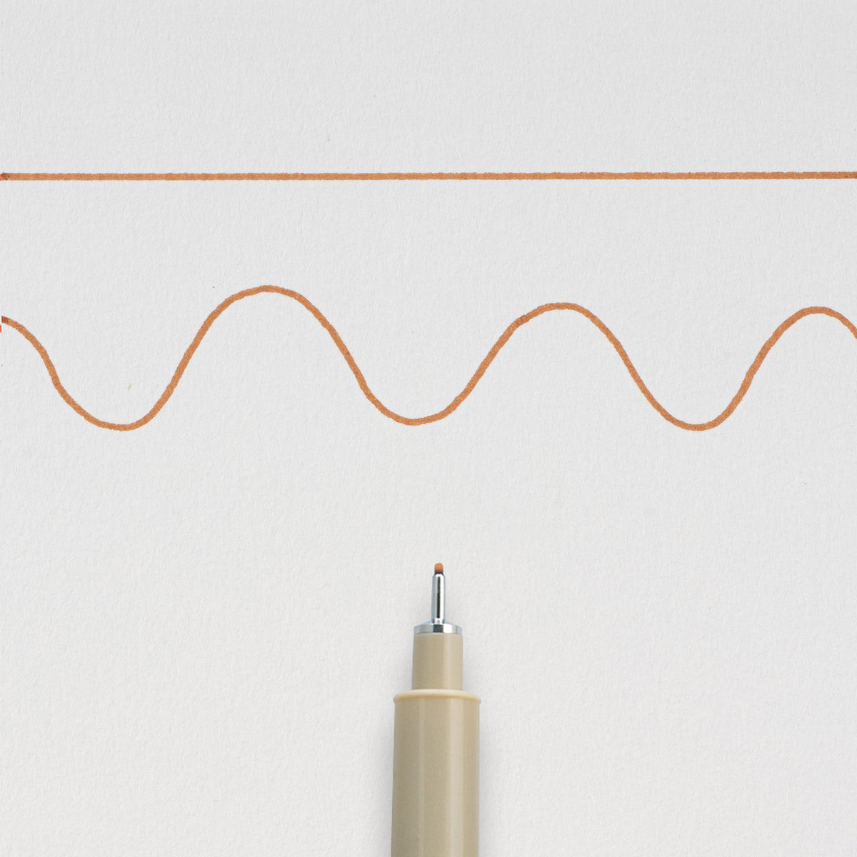 Sakura Pigma Micron 05 Brown: needle tip below a straight and a wavy 0.45mm test line drawn on white paper