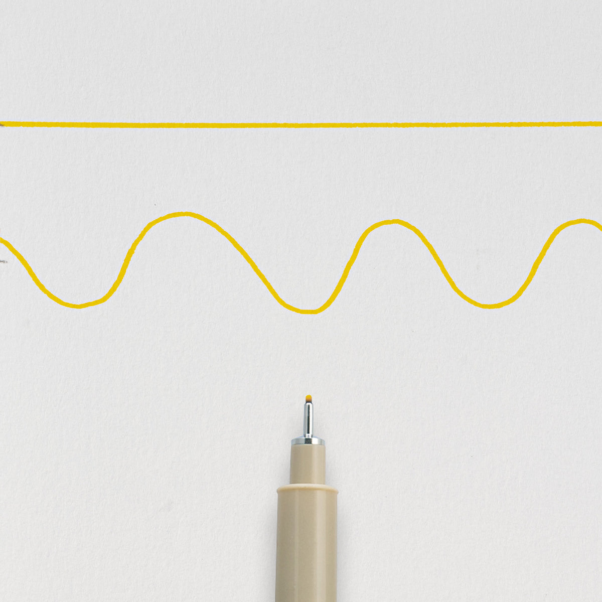 Sakura Pigma Micron 05 Yellow: needle tip below a straight and a wavy 0.45mm test line drawn on white paper
