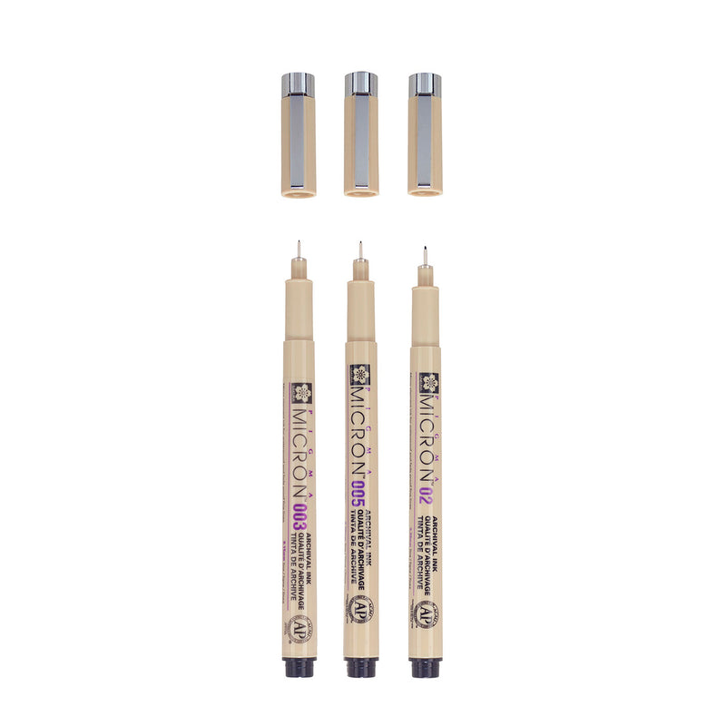 Sakura Pigma Micron 003, 005 and 02 black pens uncapped and upright, with their three caps above