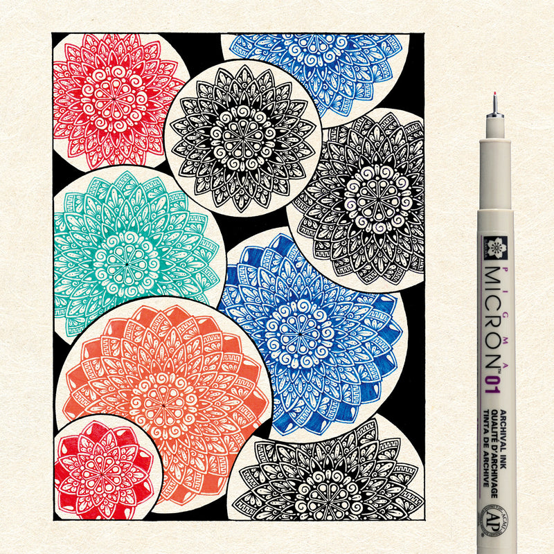 Sakura Pigma Mandala Set 01: overlapping coloured mandala illustration drawn in Pigma ink beside a single Micron 01 pen