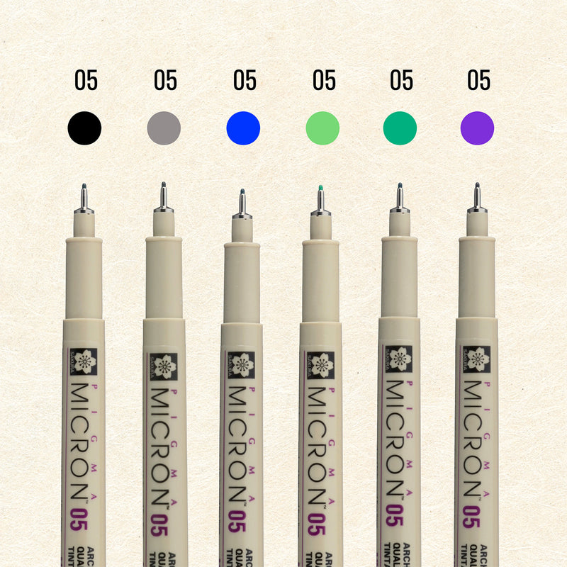 Sakura Pigma Mandala Cool Tone Set 05: six Micron 05 pens under black, grey, blue, light green, green and purple colour dots