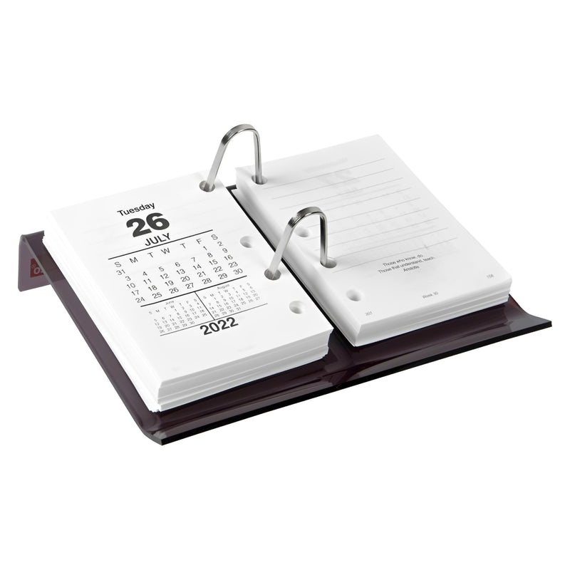 Image 4:
A clean studio product image featuring the Sasco Smoke Side Opening Desk Calendar Stand fitted with calendar refill pages against a white background. The image highlights the transparent smoke acrylic finish, dual ring mechanism and compact desktop design.