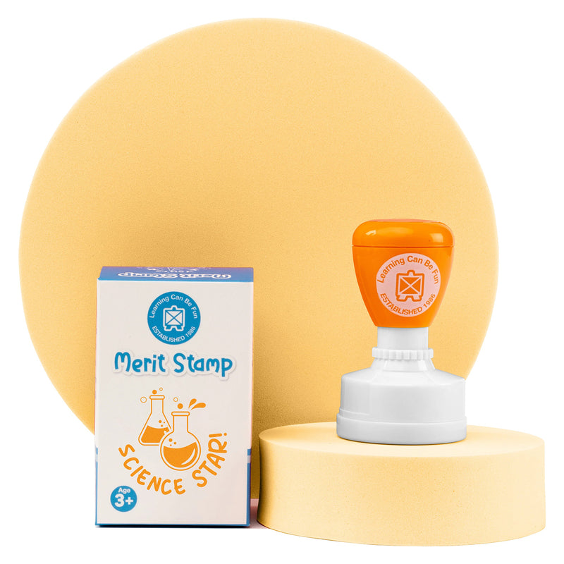Retail packaging and Science Star Merit Stamp displayed on a presentation stand with a soft yellow backdrop. The vibrant reward stamp combines durability, convenience and motivational classroom recognition for young science learners.