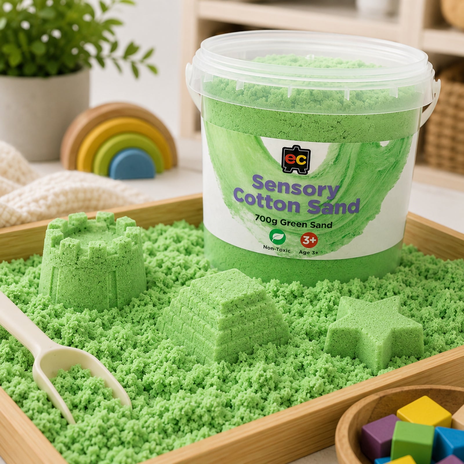 Green Educational Colours Sensory Cotton Sand displayed in a sensory tray with moulded shapes and play accessories for tactile learning activities.