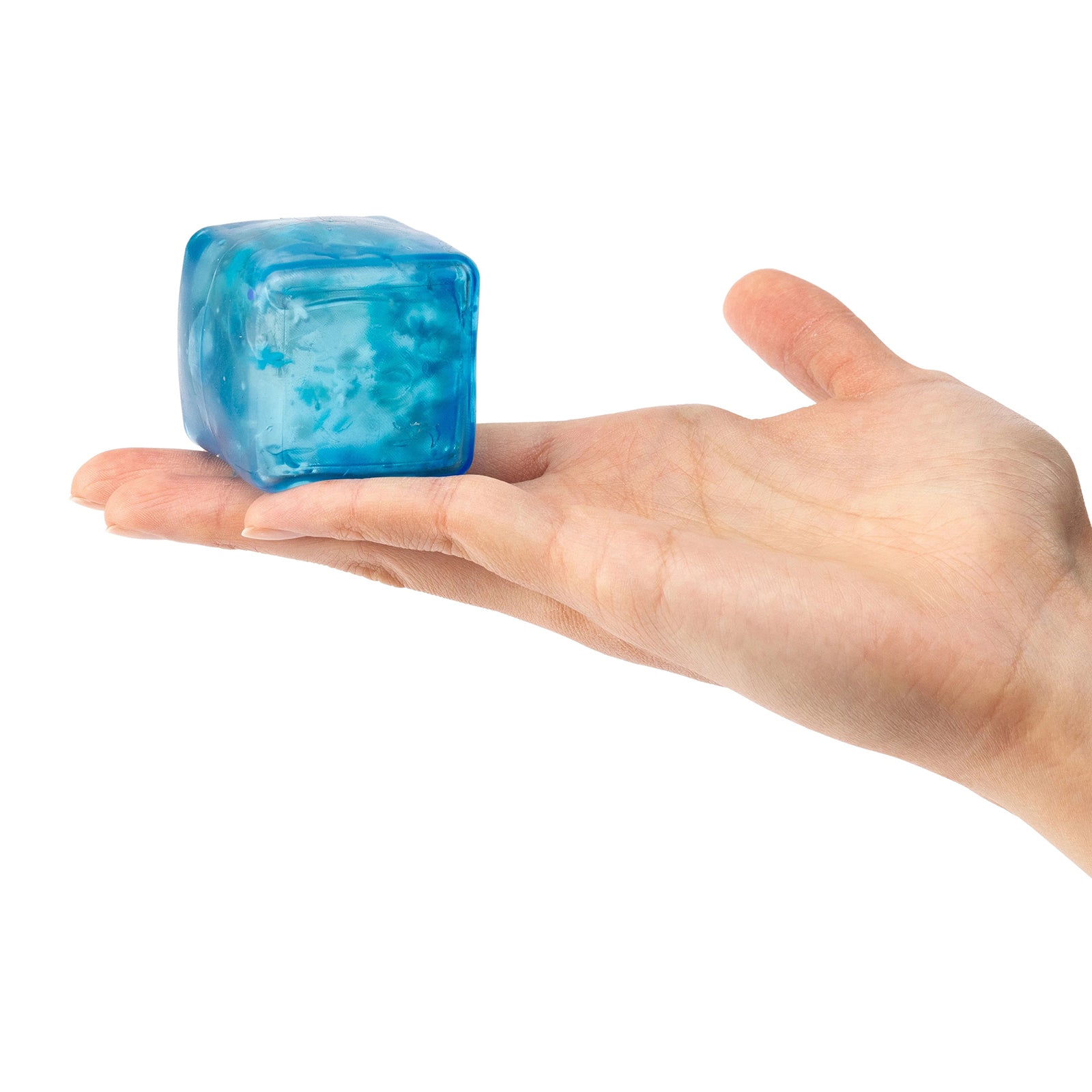 Blue jelly sensory cube resting on an open hand displaying compact size and transparent soft jelly texture with decorative snowflakes inside.