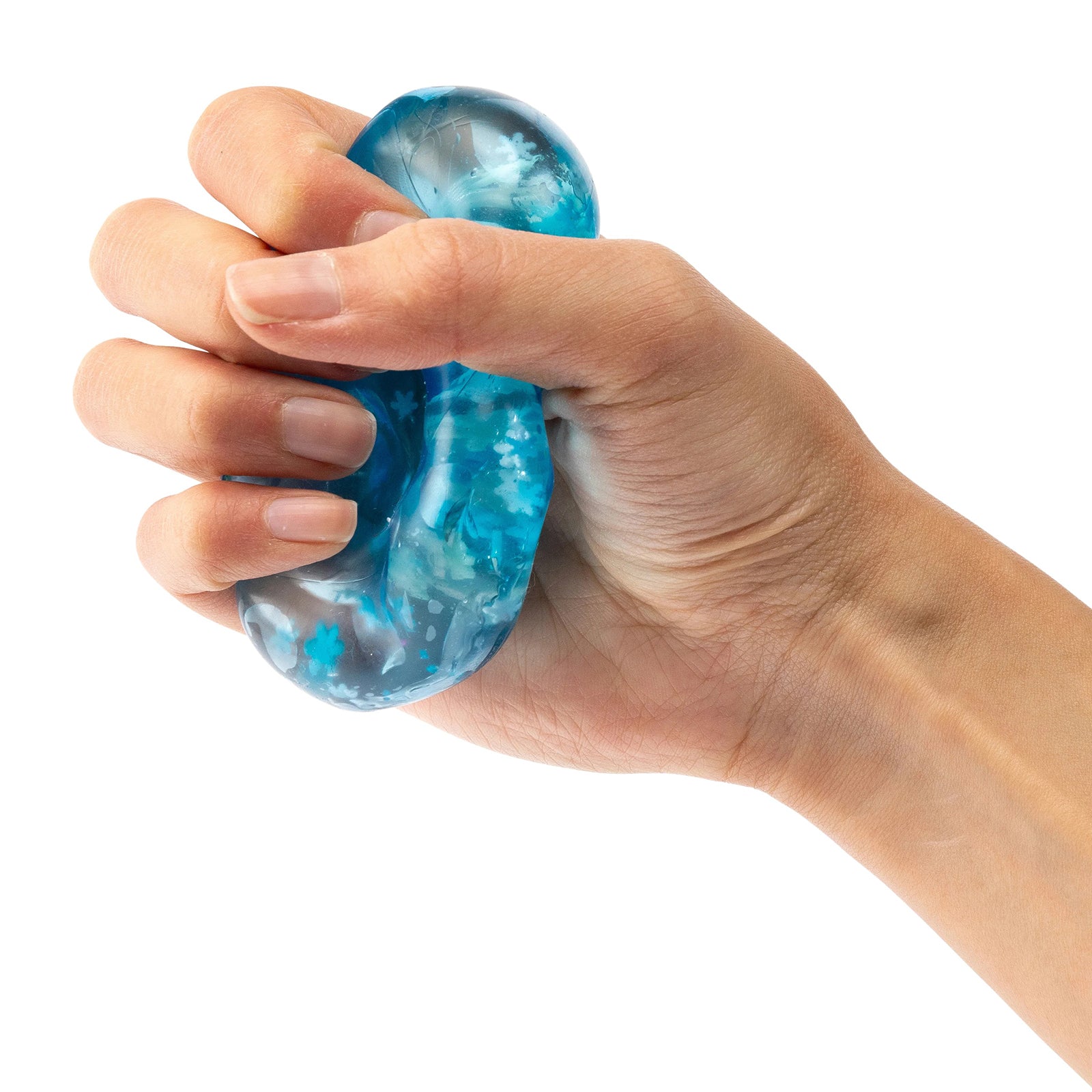 Hand squeezing the soft blue sensory jelly cube showing its flexible stress relief design and calming tactile play experience.