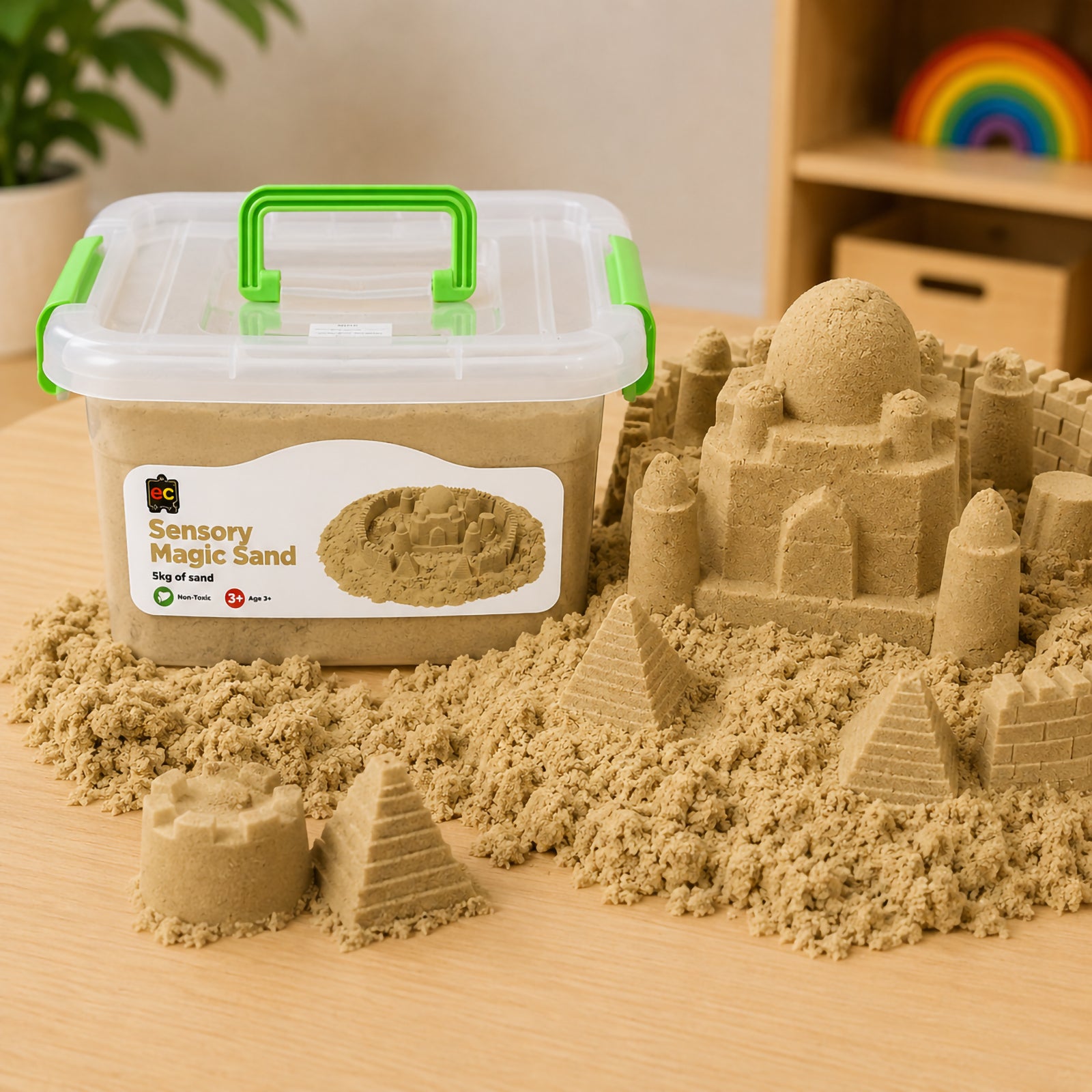Educational Colours Sensory Magic Sand 5kg Natural displayed beside highly detailed castle and pyramid creations showing the soft mouldable texture and realistic shaping ability of the sensory sand.
