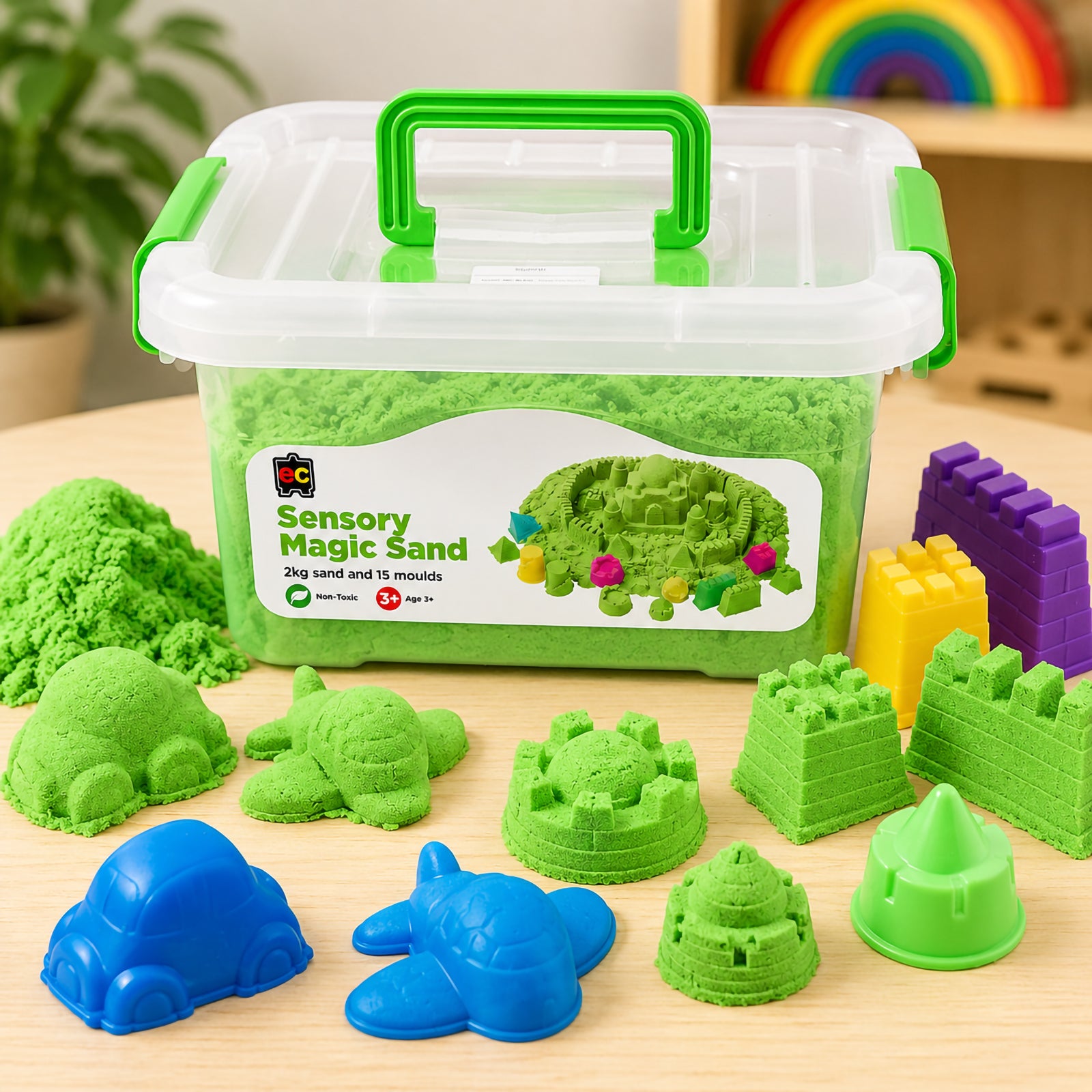 Educational Colours Sensory Magic Sand with Moulds 2kg Green displayed with castle shapes, vehicle moulds, and sensory play accessories in learning environment.
