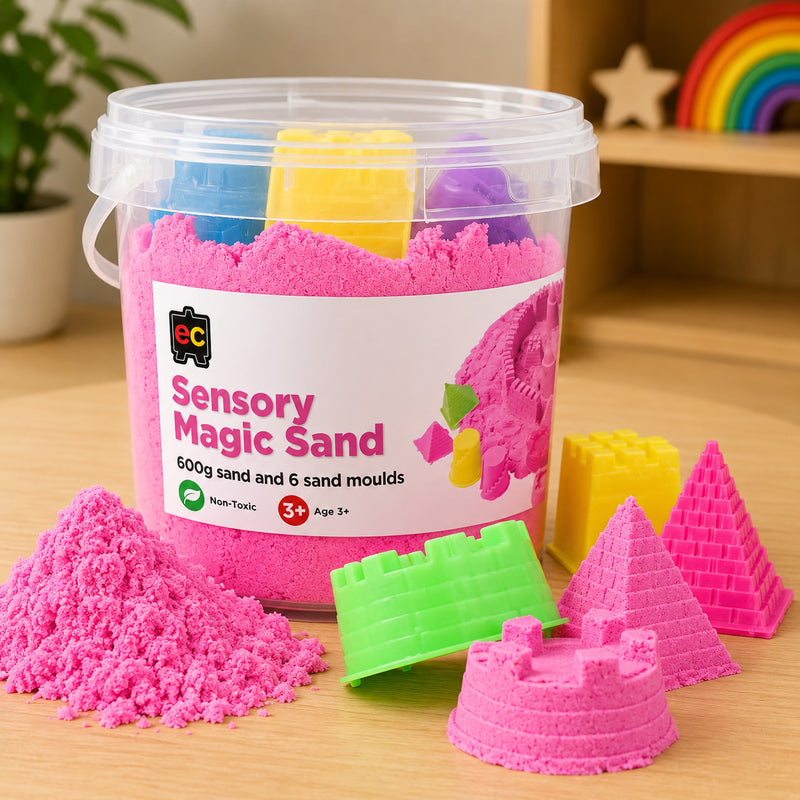 Educational Colours Sensory Magic Sand with Moulds 600g Pink displayed in reusable storage tub with pyramid and castle mould creations.