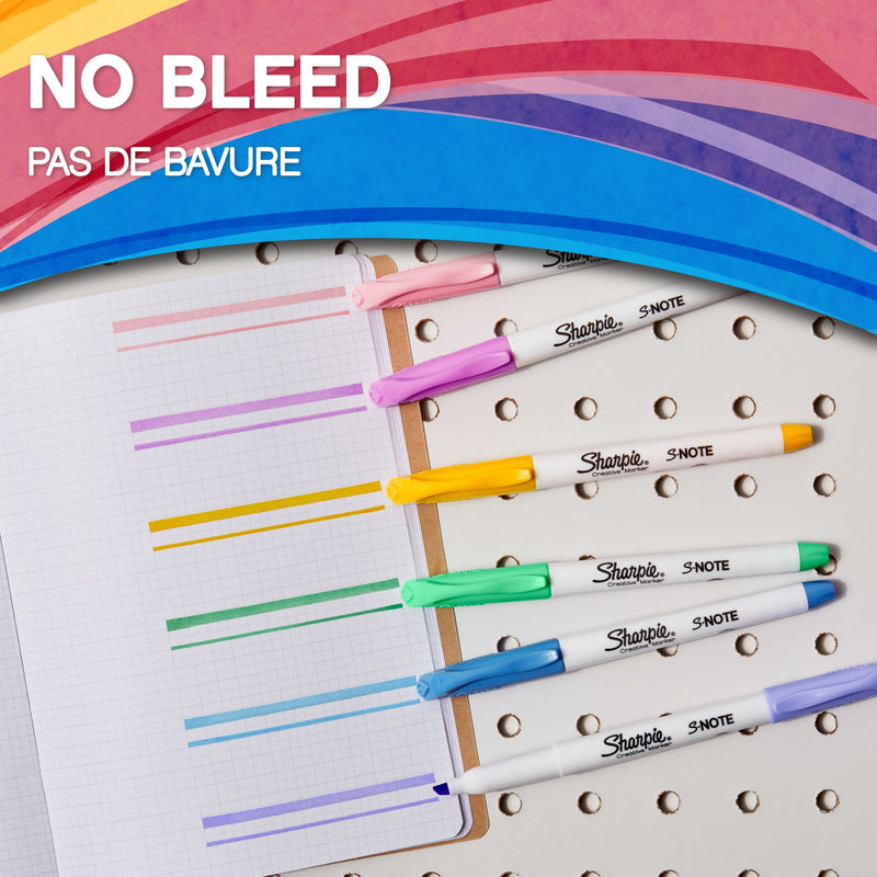 Sharpie S-Note markers on a notebook with colour strokes, captioned No bleed in English and French